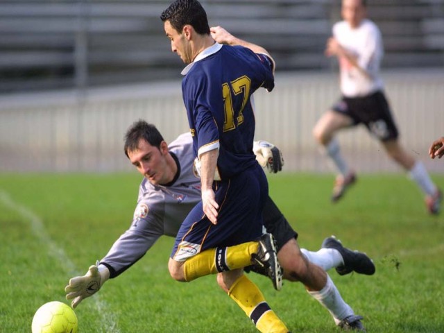 Astros Vs. London  (640Wx480H) - Guillermo Compton Hall, gets around London keeper Alton Ruci. 